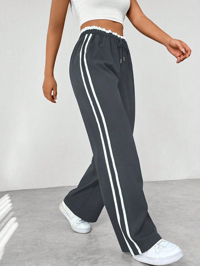 Katia | Sporthose mit hoher Taille, seitlichen Streifen und lockerem Schnitt