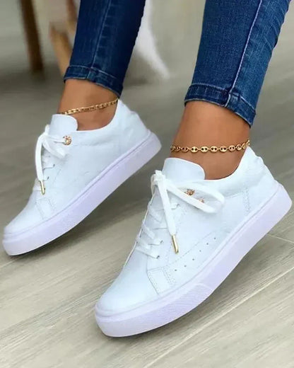 Selira | Sneakers with gold details and white laces