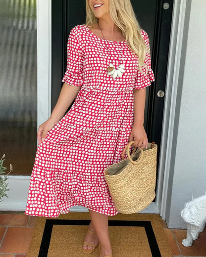 Estrella| Relaxed midi dress with polka dots and short sleeves