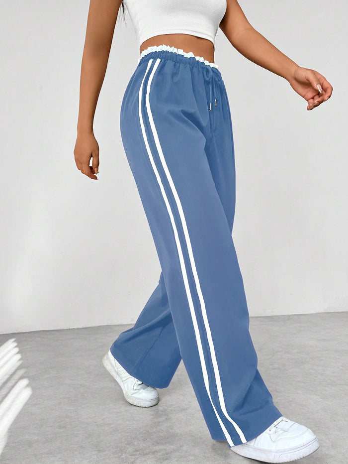 Katia | Sporthose mit hoher Taille, seitlichen Streifen und lockerem Schnitt