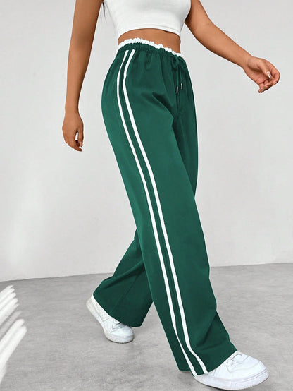 Katia | Sporthose mit hoher Taille, seitlichen Streifen und lockerem Schnitt