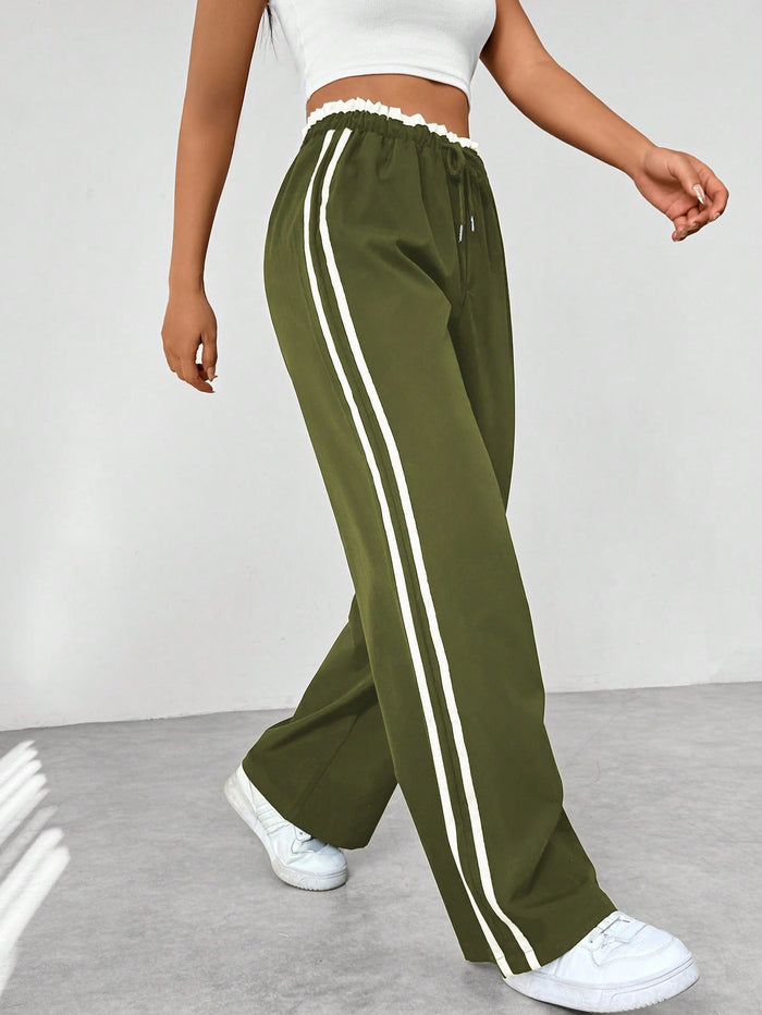 Katia | Sporthose mit hoher Taille, seitlichen Streifen und lockerem Schnitt