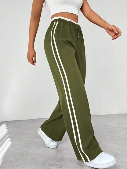 Katia | Sporthose mit hoher Taille, seitlichen Streifen und lockerem Schnitt