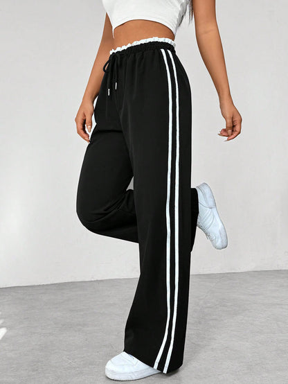 Katia | Sporthose mit hoher Taille, seitlichen Streifen und lockerem Schnitt